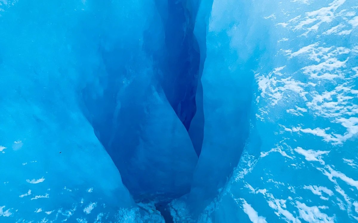 A small roped group crossing deep into the Perito Moreno Glacier on the Big Ice trek