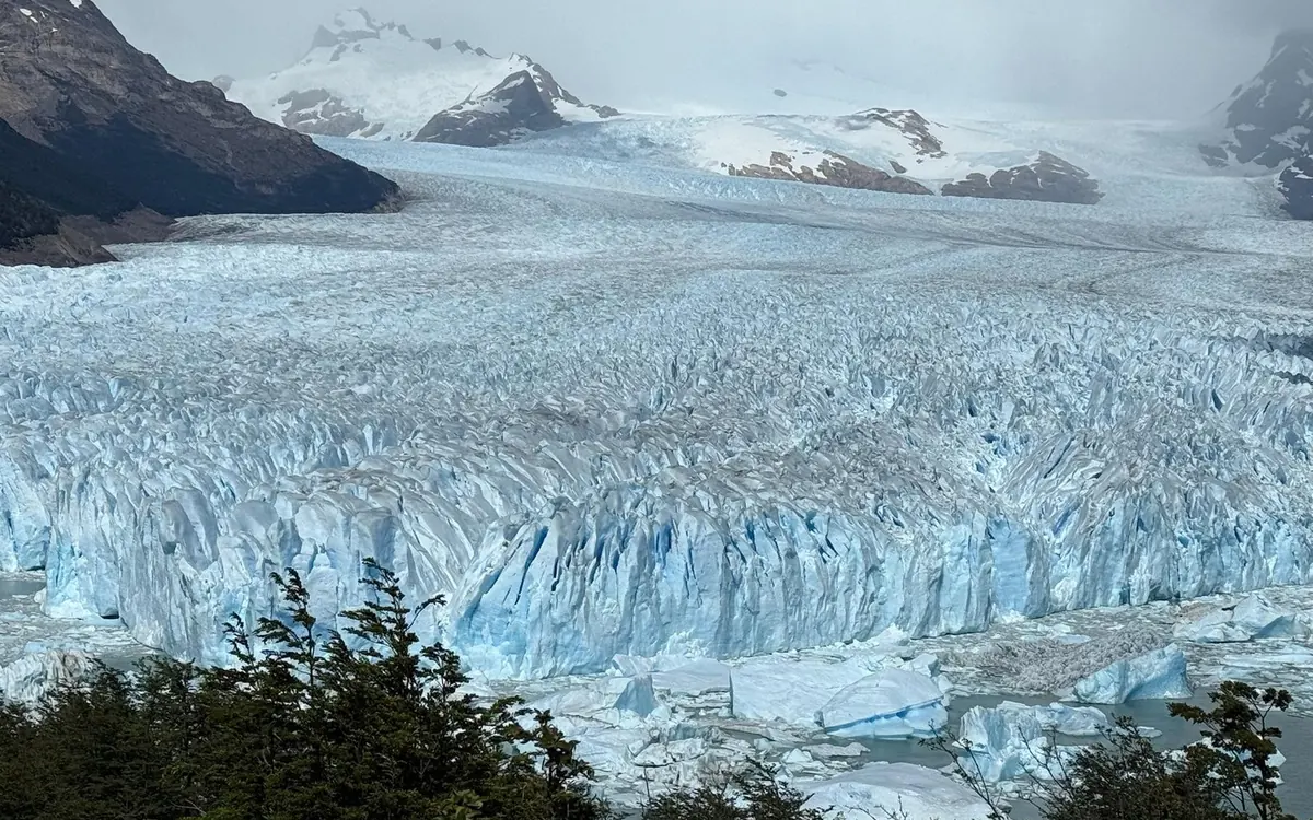 The Perito Moreno Glacier ice wall under the changing light of the Patagonian seasons
