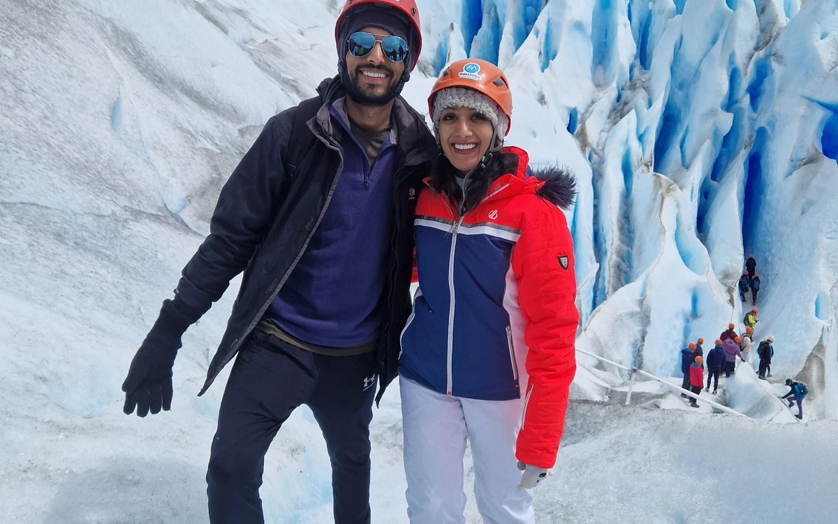 Layered clothing and sturdy boots laid out before a crampon walk on the Perito Moreno Glacier