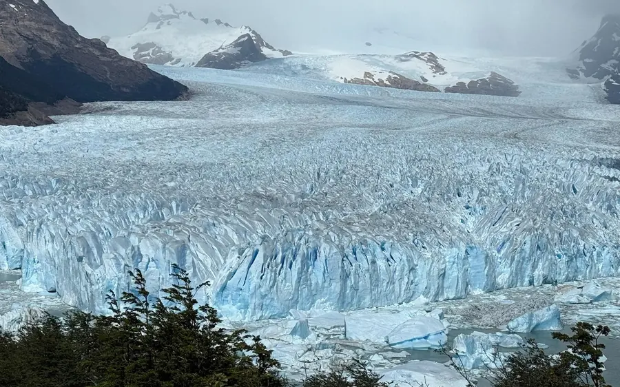 A sightseeing boat in front of the northern wall of the Perito Moreno Glacier